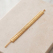 1 Line Patta Bracelet (D36) on travertine