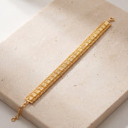 1 Line Patta Bracelet (D38) on travertine