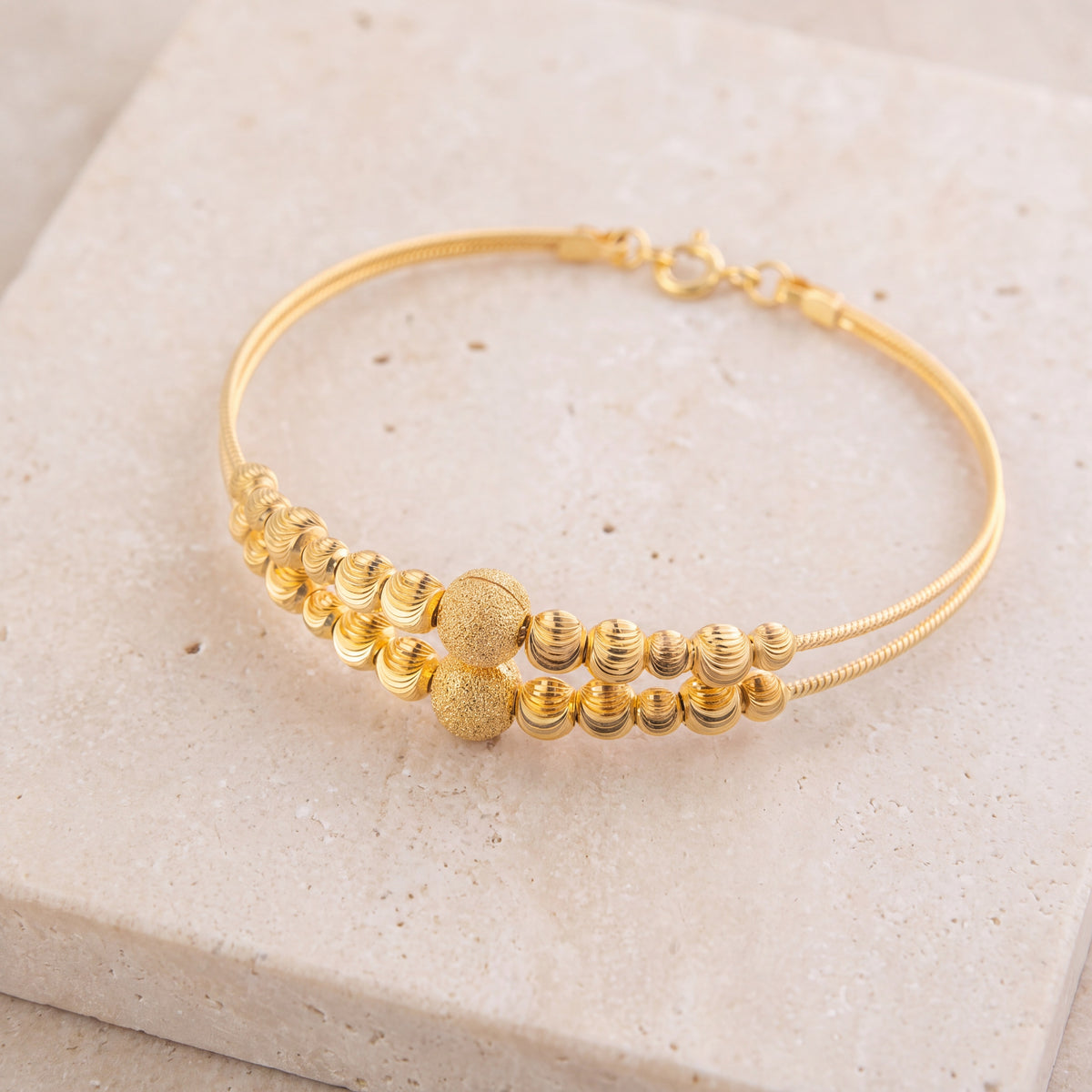 2 Line Kid's Beads Cuff Bracelet (D103) on travertine