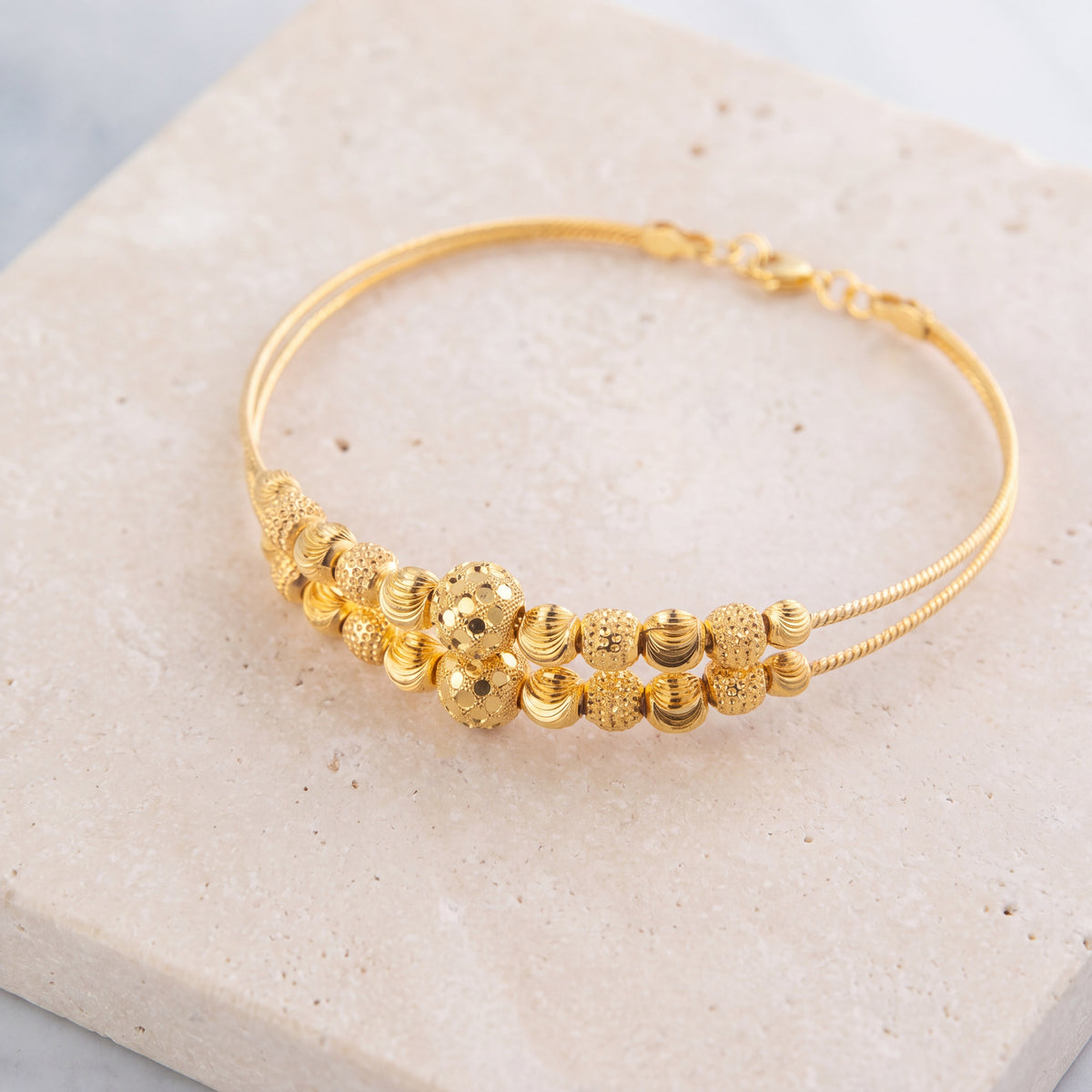 2 Line Kid's Beads Cuff Bracelet (D121) on travertine
