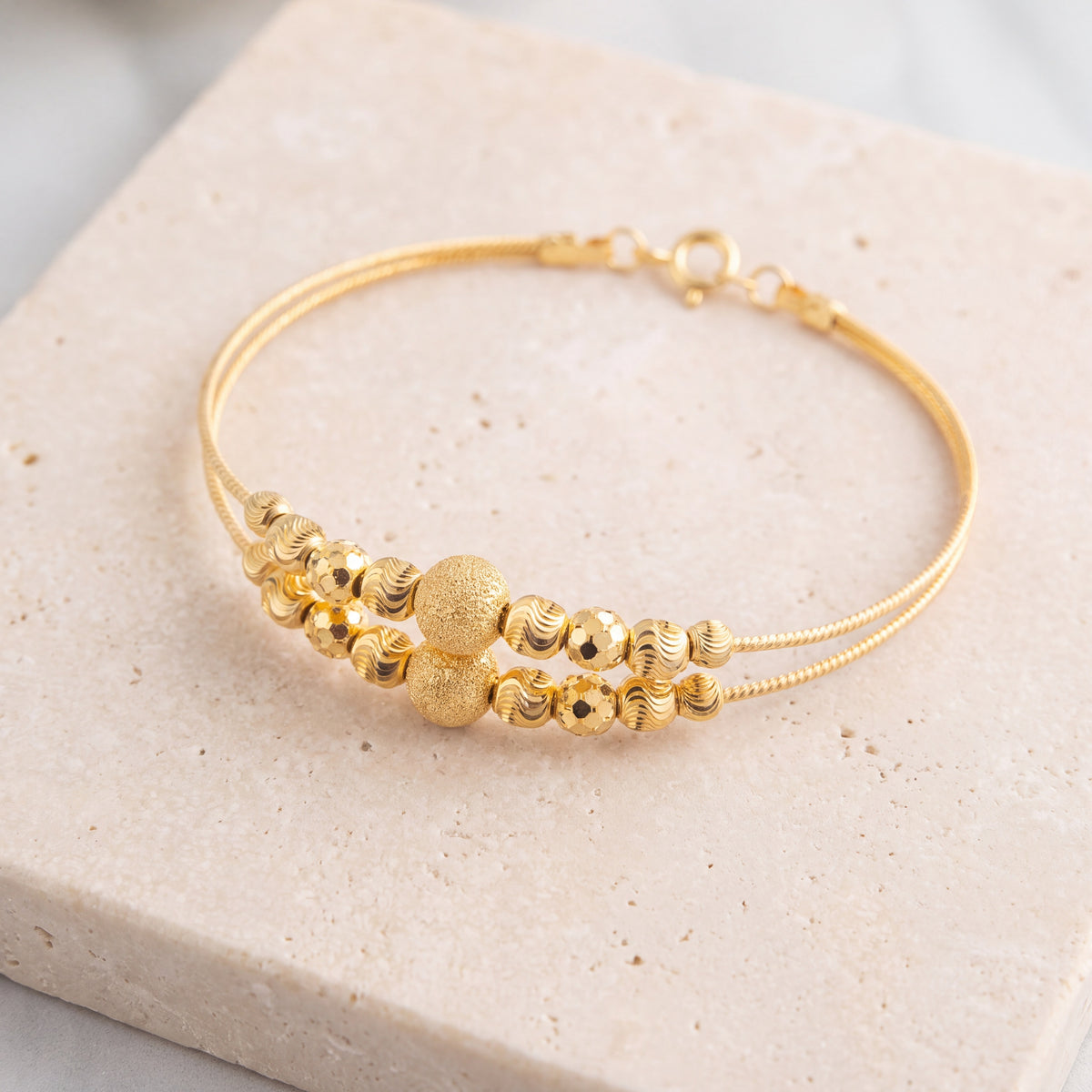 2 Line Kid's Beads Cuff Bracelet (D128) on travertine