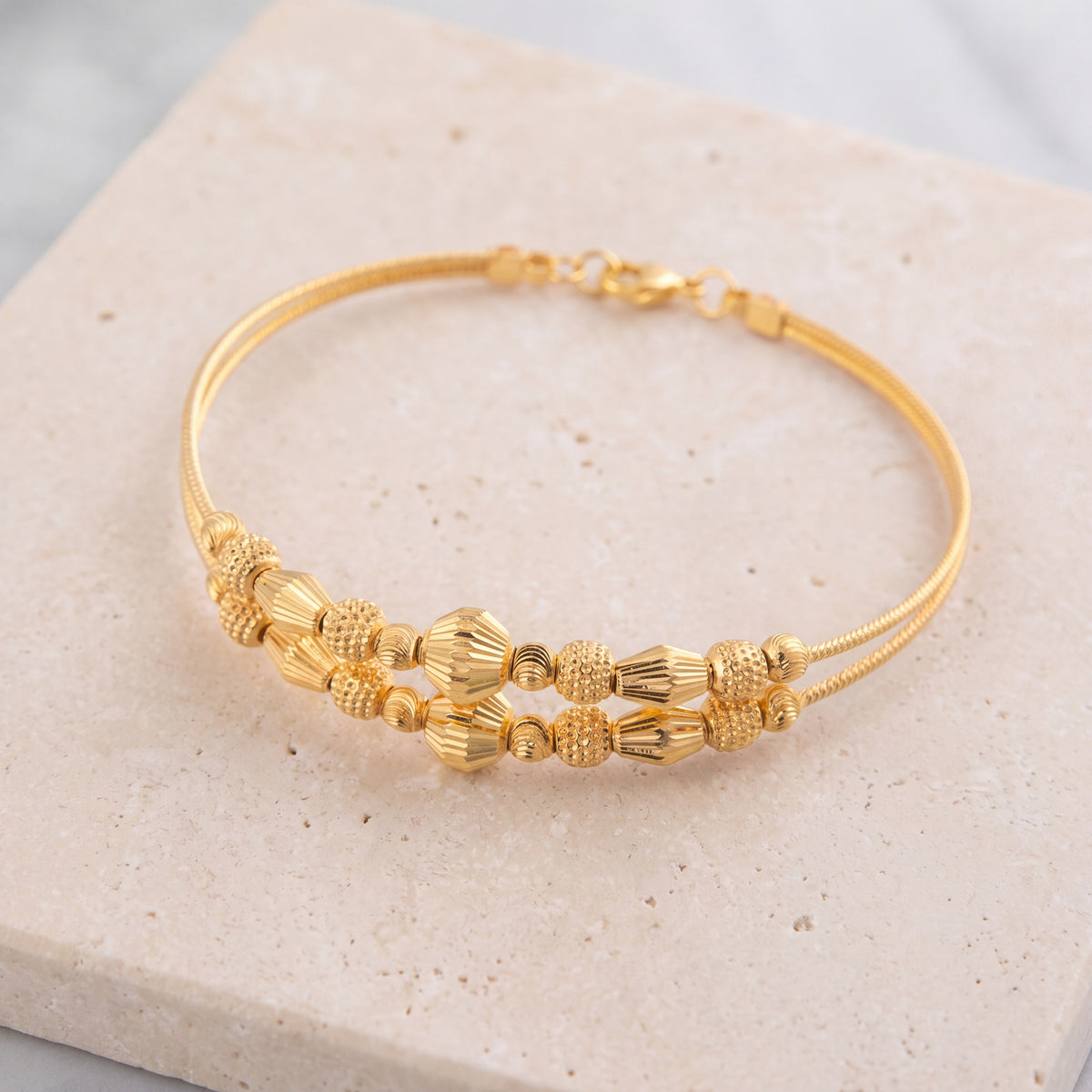2 Line Kid's Beads Cuff Bracelet (D44) on travertine