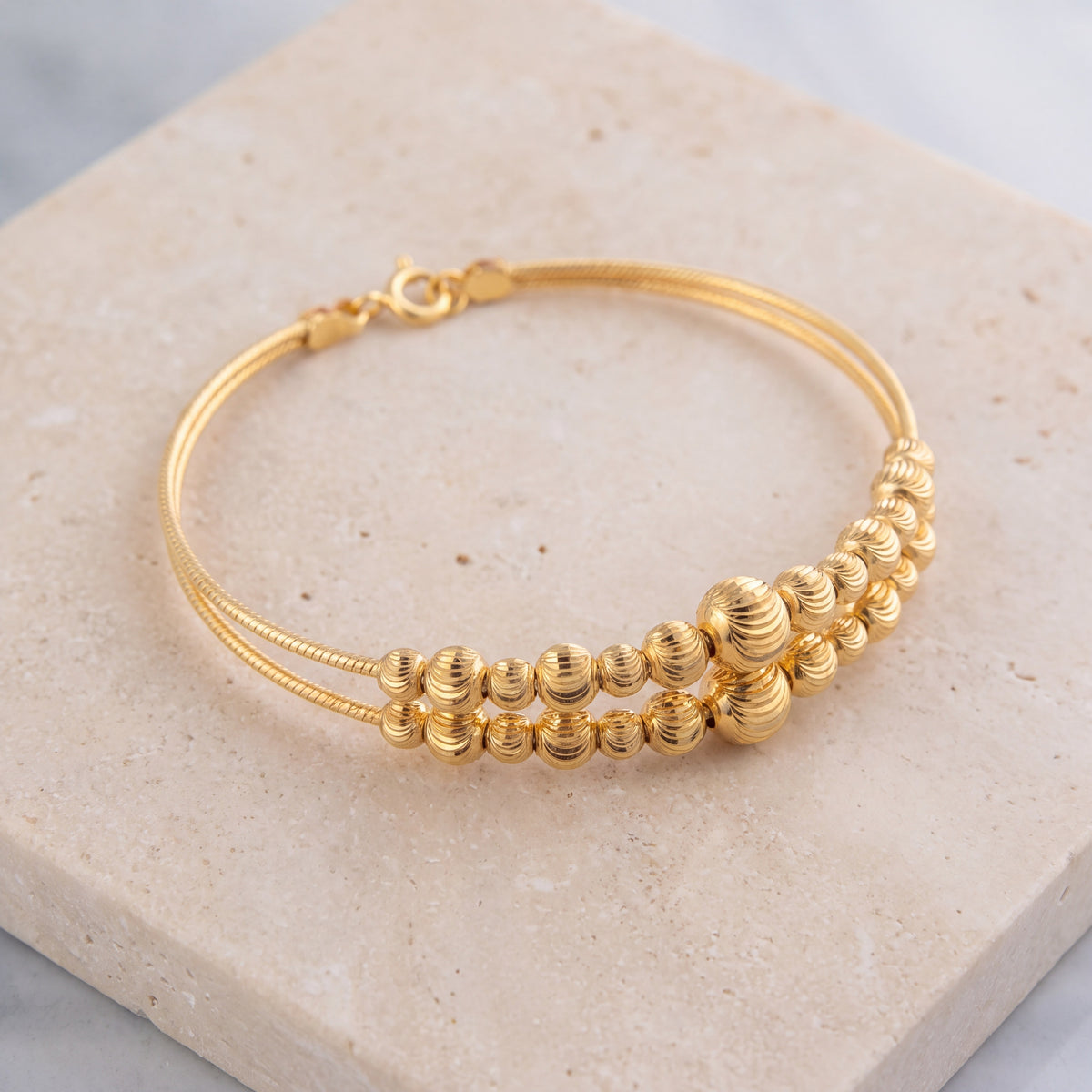 2 Line Kid's Beads Cuff Bracelet (D69) on travertine