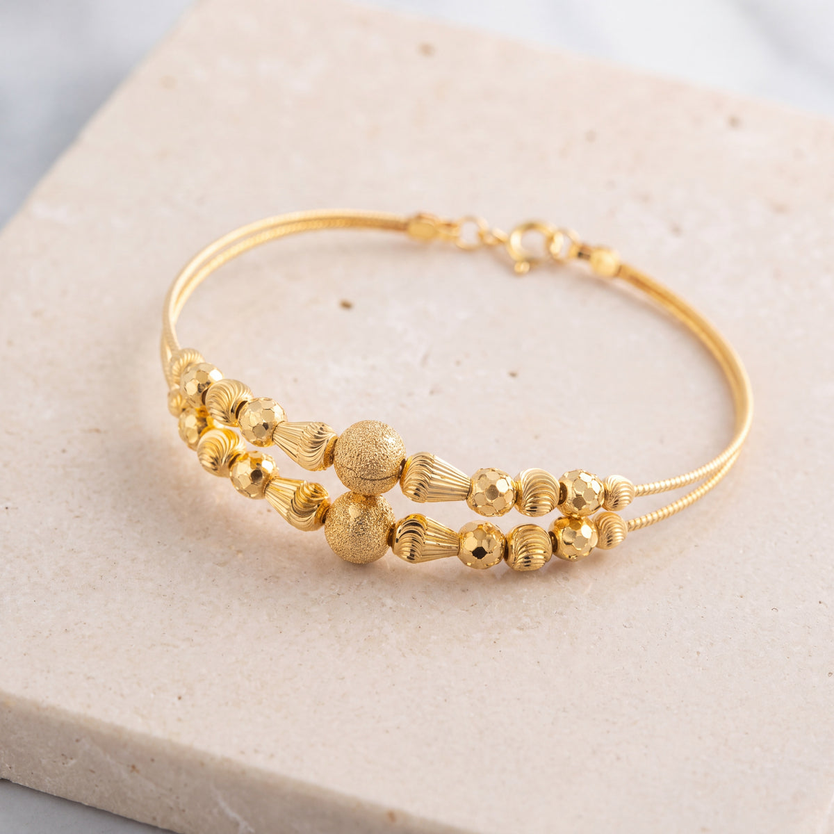 2 Line Kid's Beads Cuff Bracelet (D72) on travertine