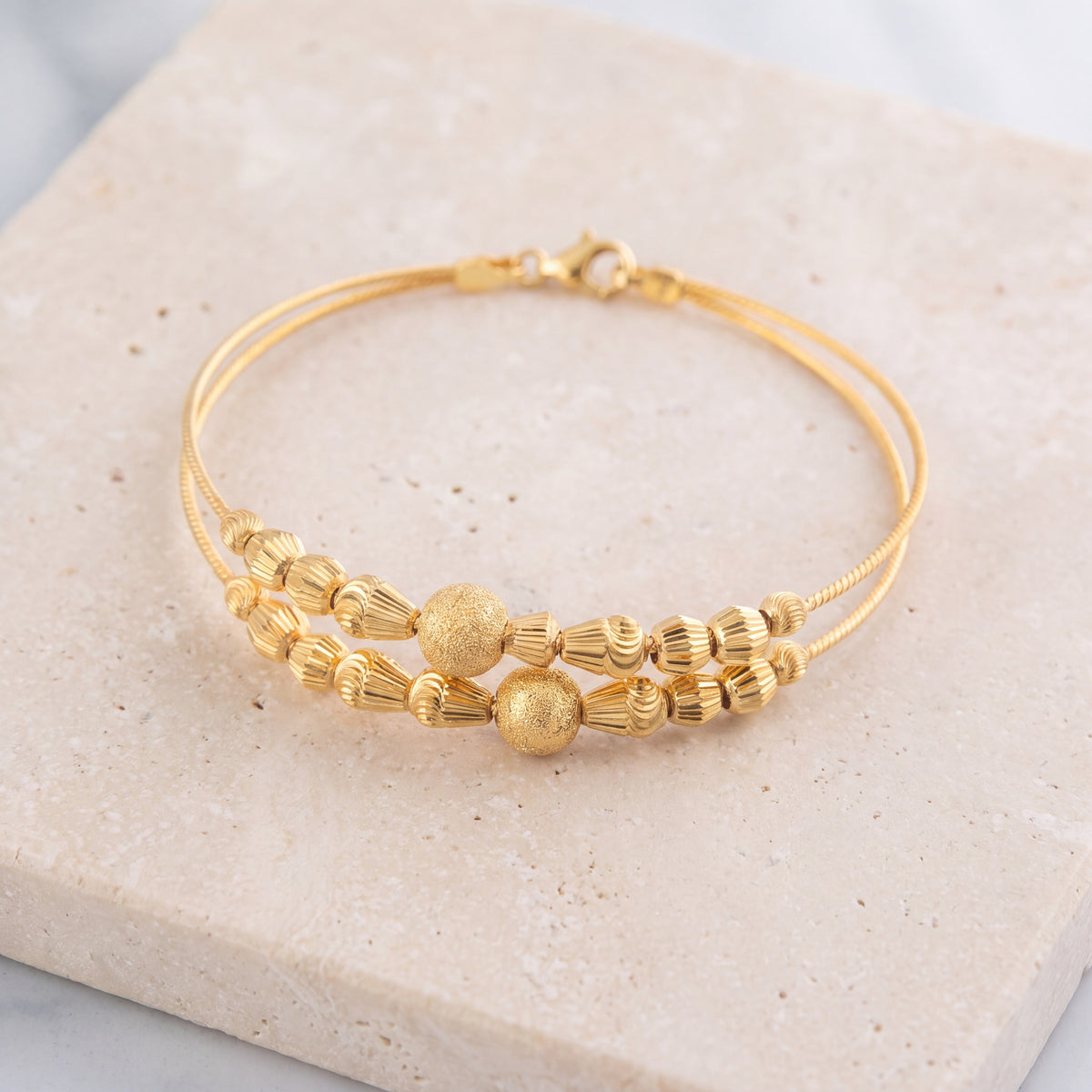 2 Line Kid's Beads Cuff Bracelet (D75) on travertine