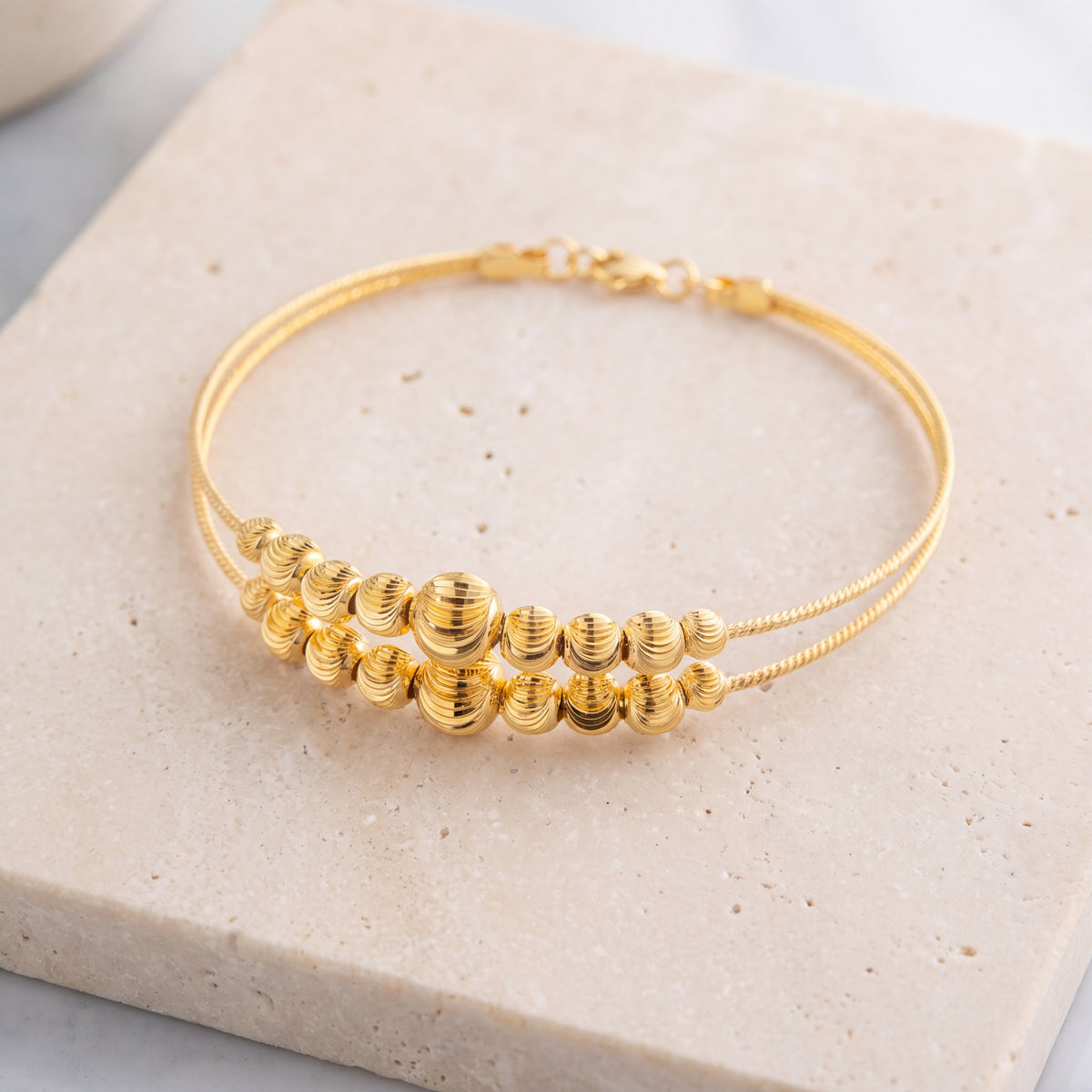 2 Line Kid's Beads Cuff Bracelet (D84) on travertine