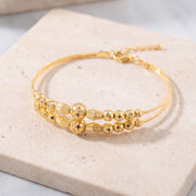 2 Line Kid's Beads Cuff Bracelet (D97) on travertine