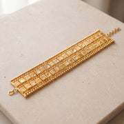 2 Line Patta Bracelet (D2) on travertine
