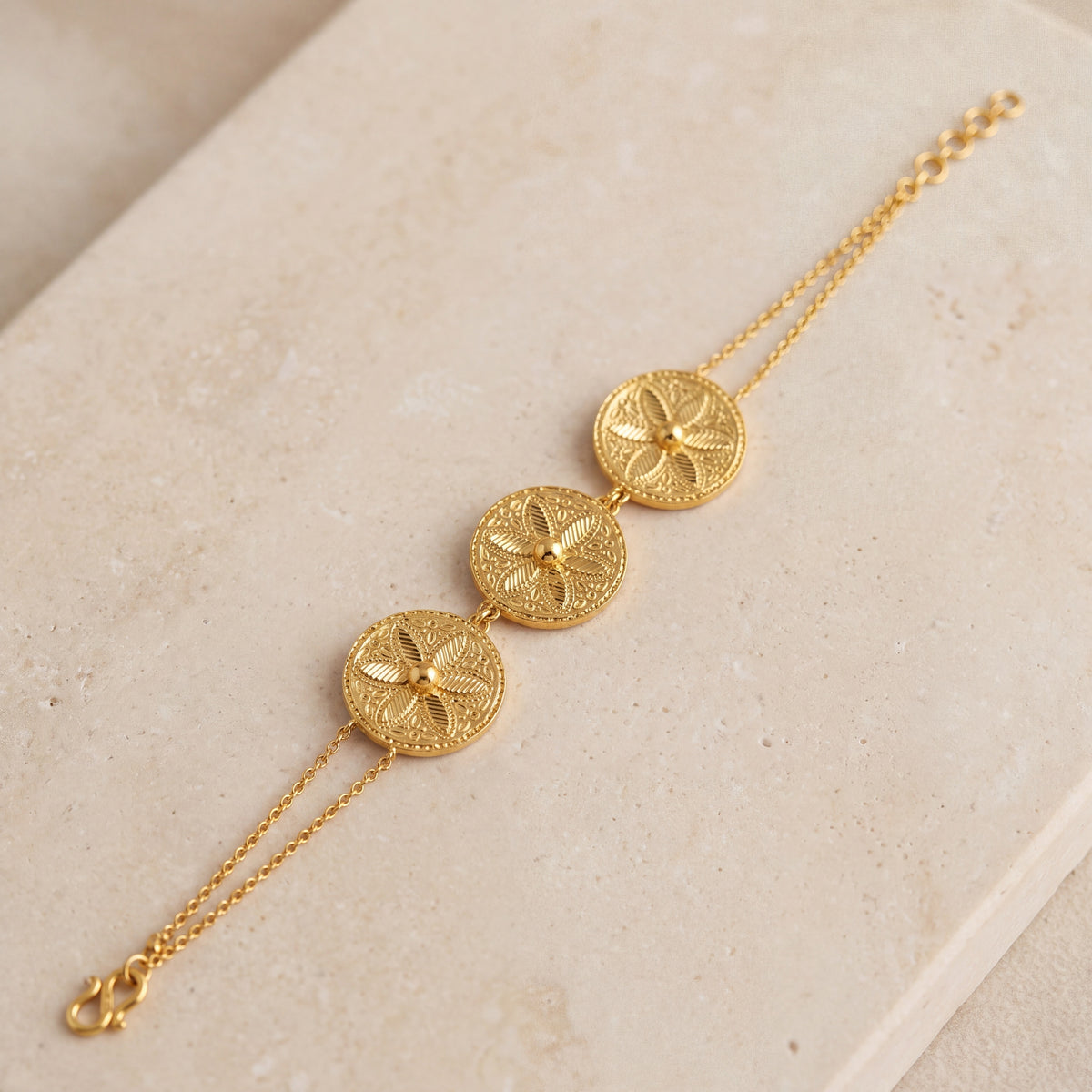 3 Coin Piece Bracelet (D1) on travertine