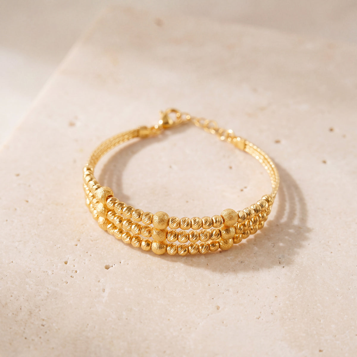 3 Line Kid's Beads Cuff Bracelet (D2) on travertine