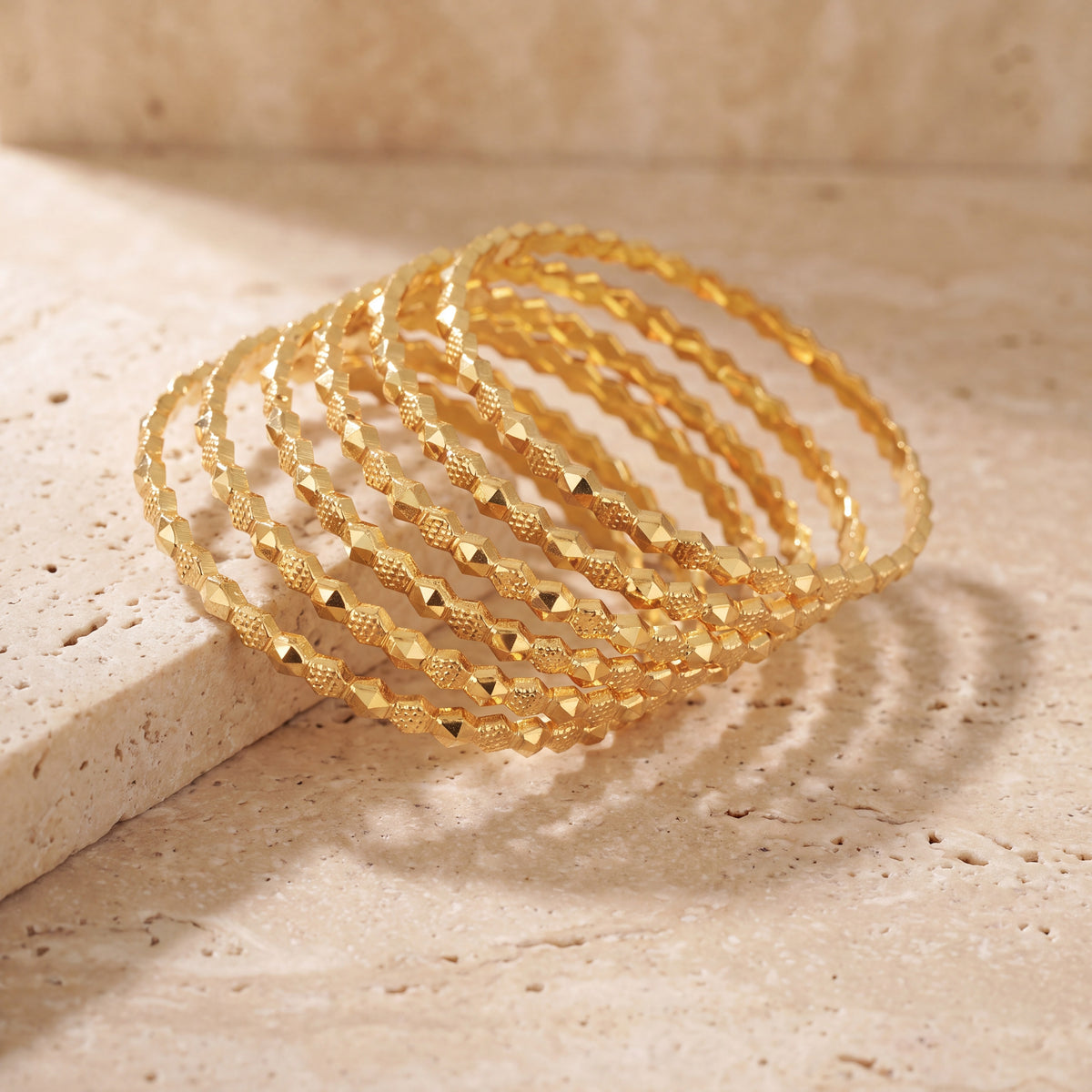 Adult's Bangles (D42-K) on travertine