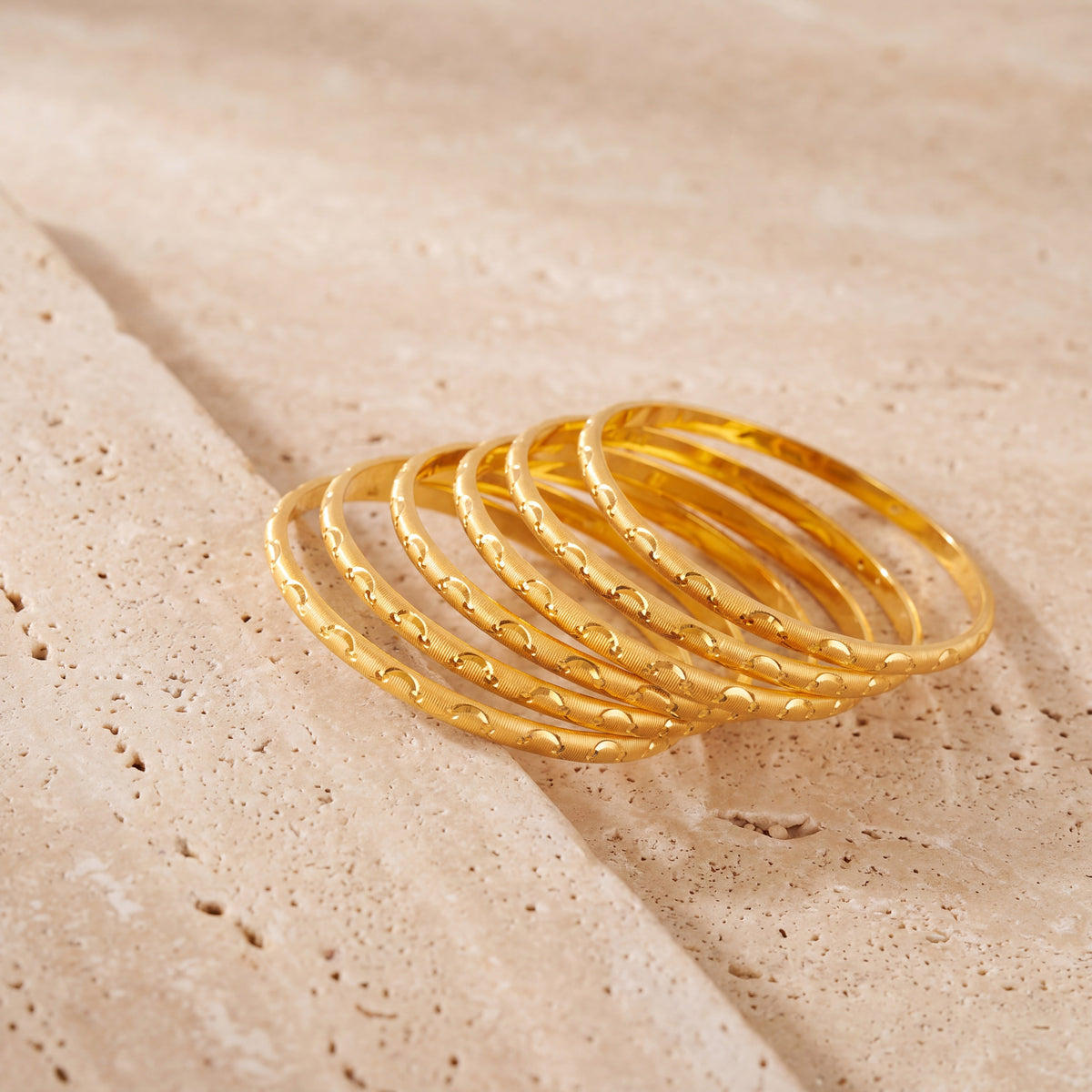 Adult's Bangles (D66-K) on travertine stone