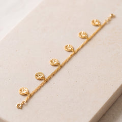 Ahad Logo Bracelet (D1) on travertine