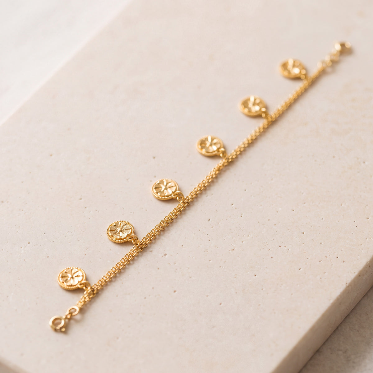 Ahad Logo Bracelet (D1) on travertine
