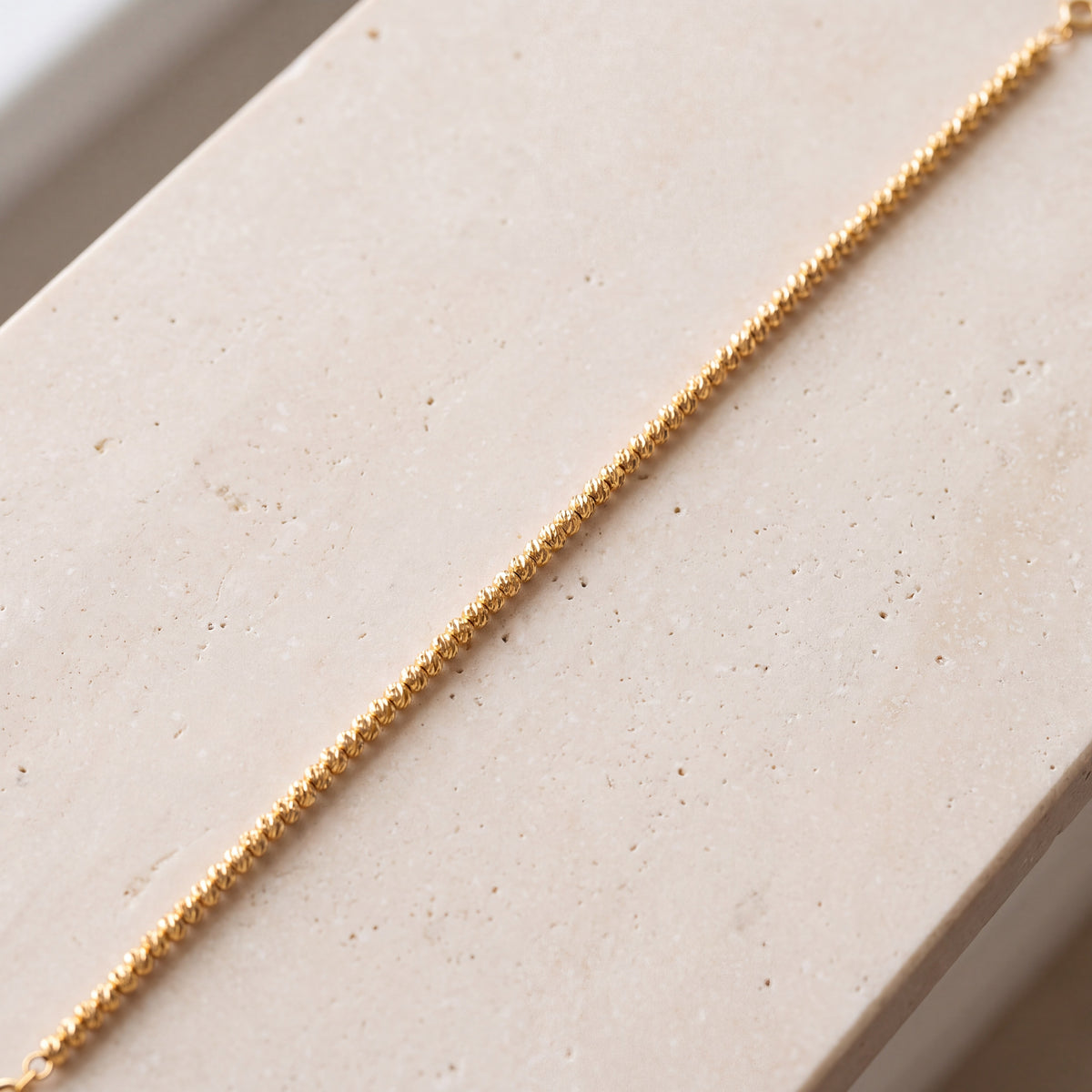 Beads Balls Bracelet (D3) on travertine