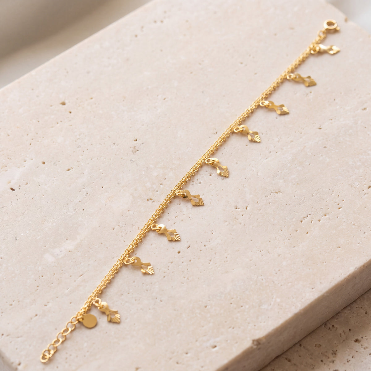 Charm Bracelet (D32) on travertine