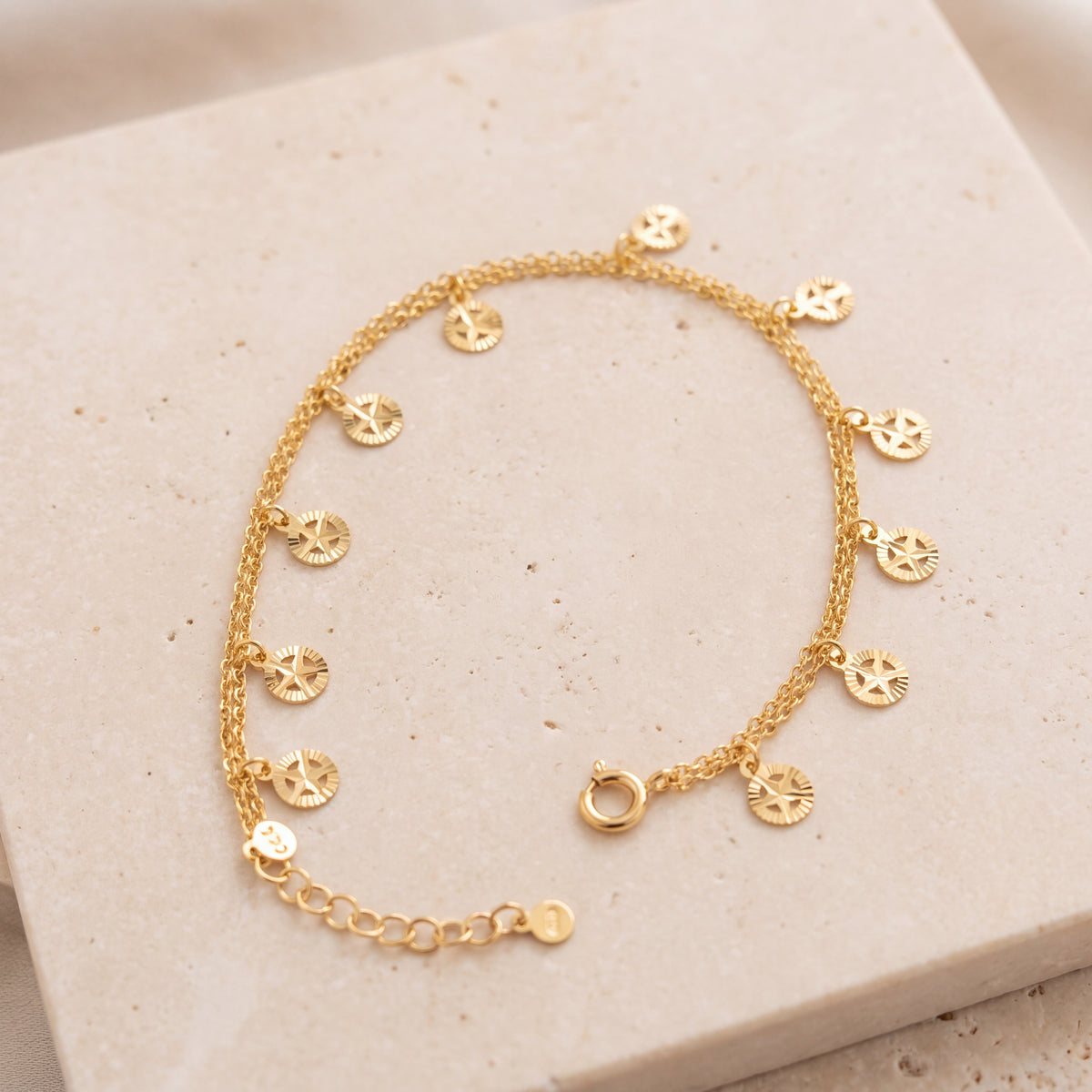 Charm Bracelet (D33) on travertine