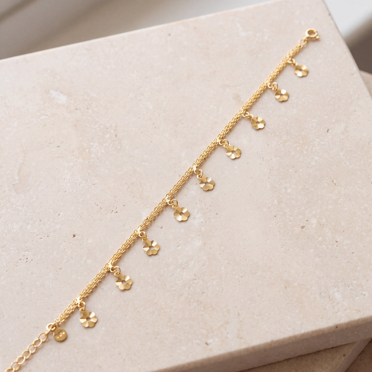 Charm Bracelet (D34) on travertine