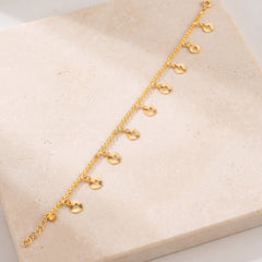 Charm Bracelet (D35) on travertine