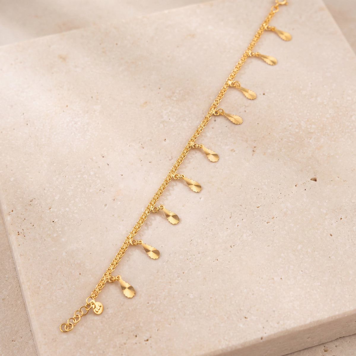 Charm Bracelet (D37) on travertine