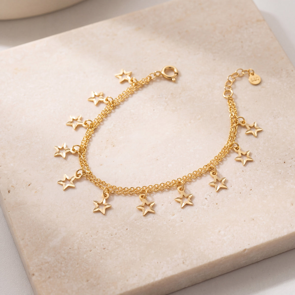 Charm Bracelet (D38) on travertine