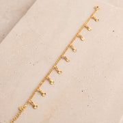 Charm Bracelet (D41) on travertine