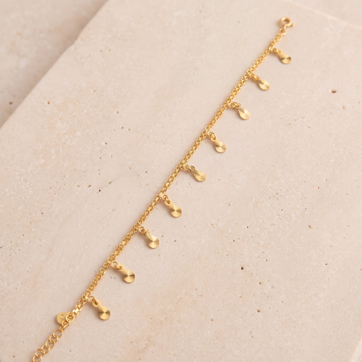 Charm Bracelet (D41) on travertine