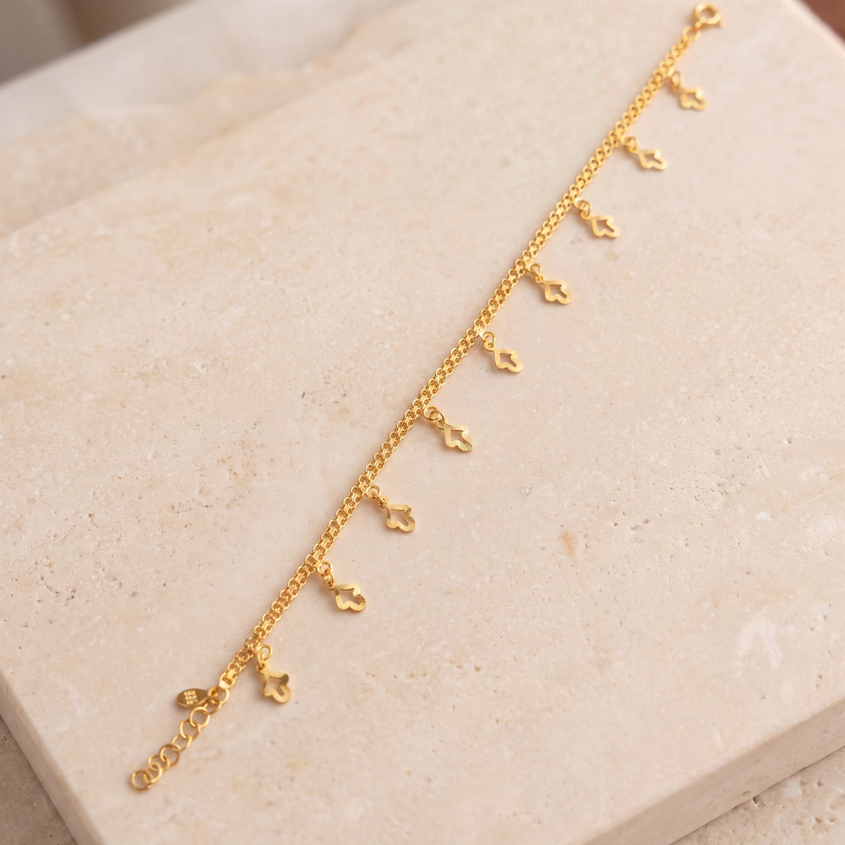 Charm Bracelet (D42) on travertine