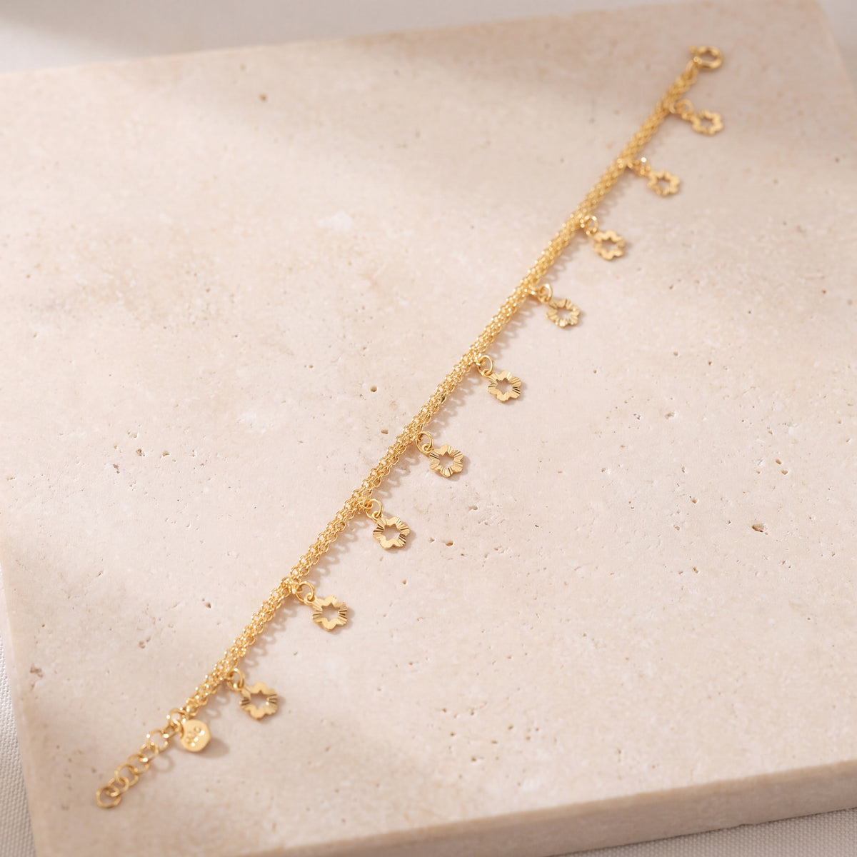 Charm Bracelet (D45) on travertine