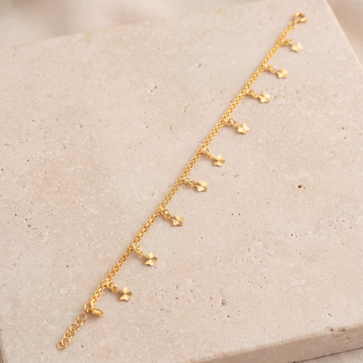 Charm Bracelet (D46) on travertine