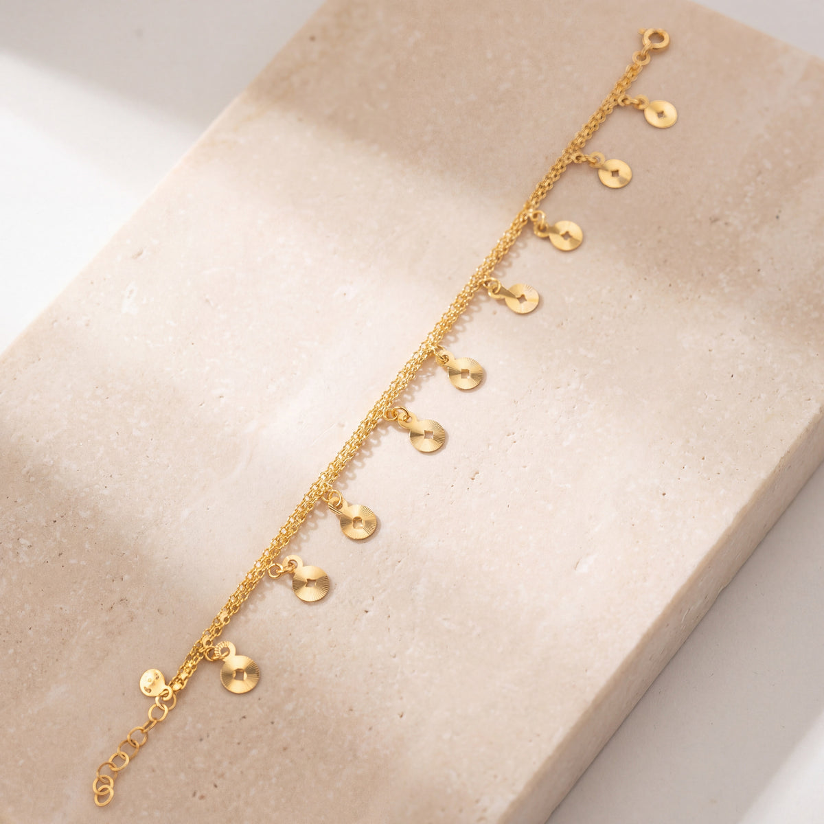 Charm Bracelet (D49) on travertine