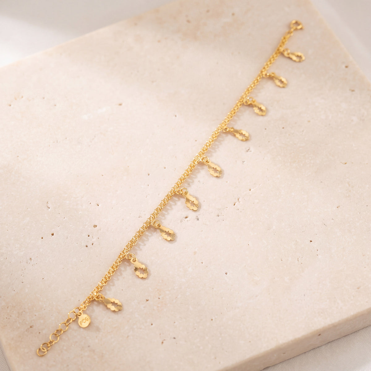 Charm Bracelet (D51) on travertine