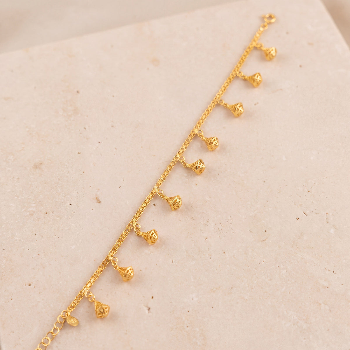 Charm Bracelet (D60) on travertine