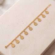 Coin Bracelet (D1) on travertine