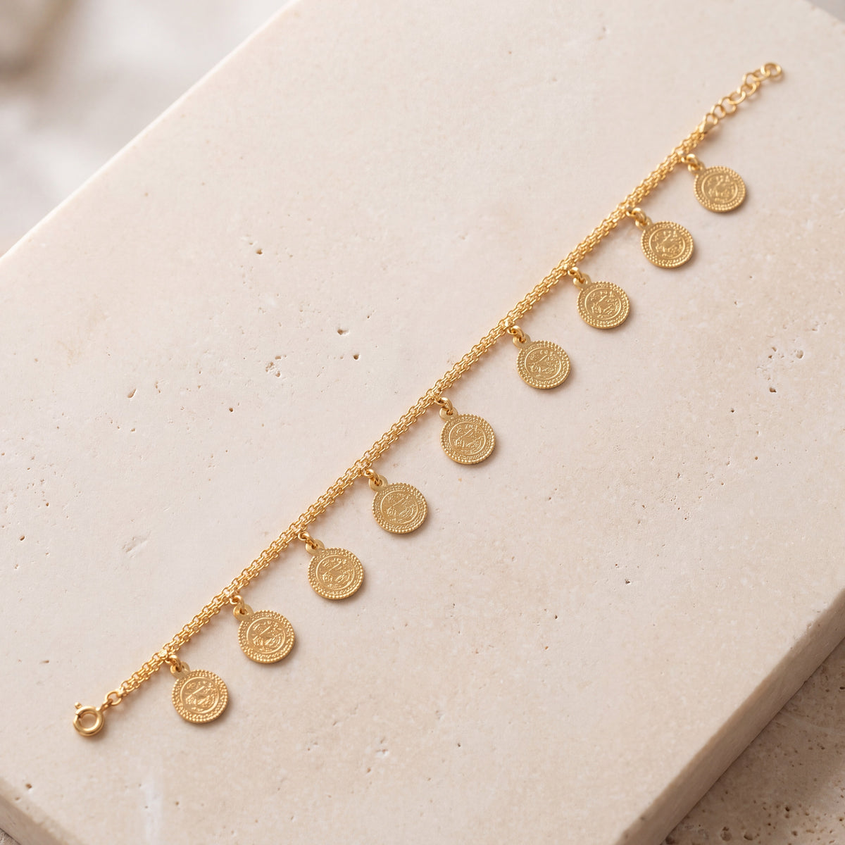 Coin Bracelet (D1) on travertine