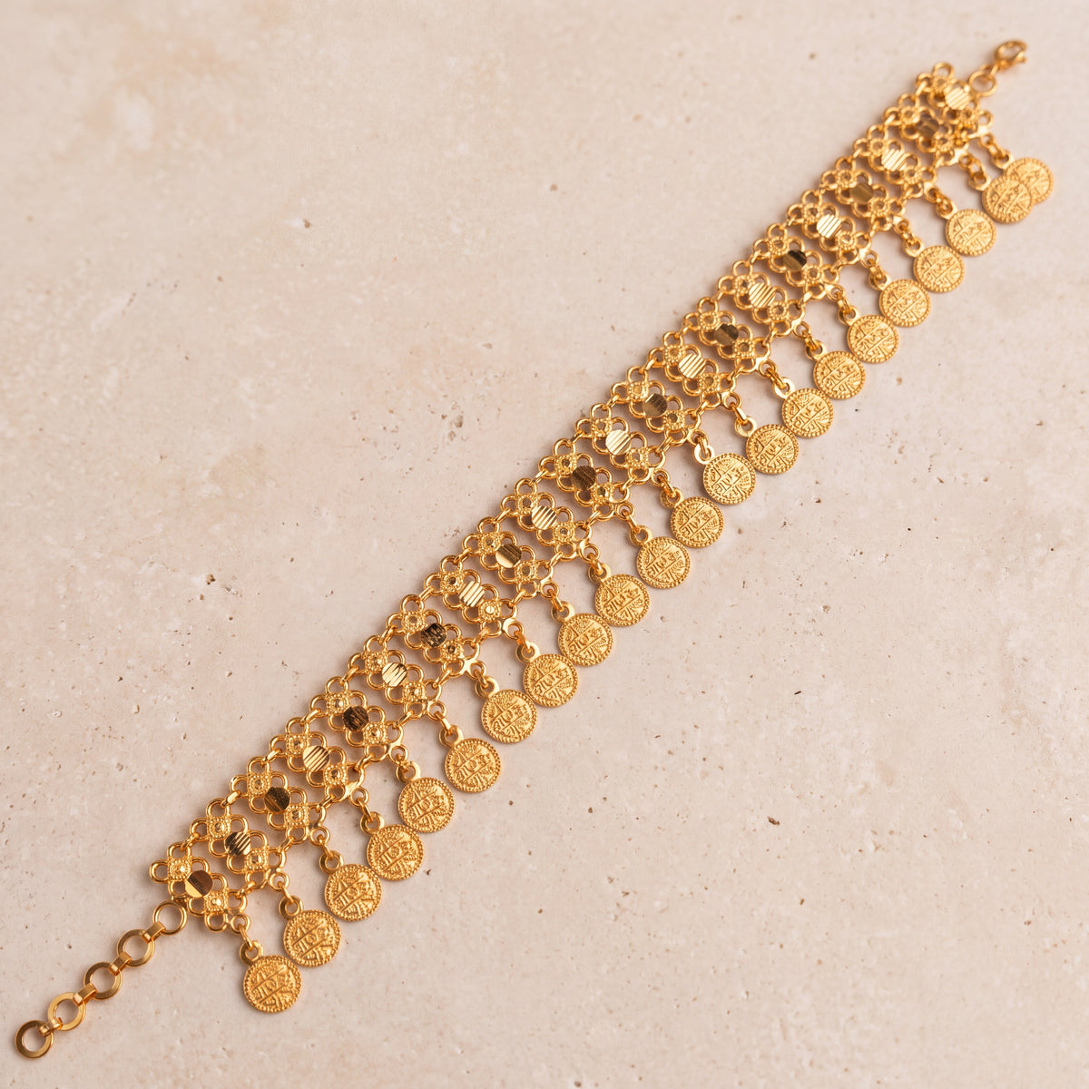 Coin Bracelet (D5) on travertine