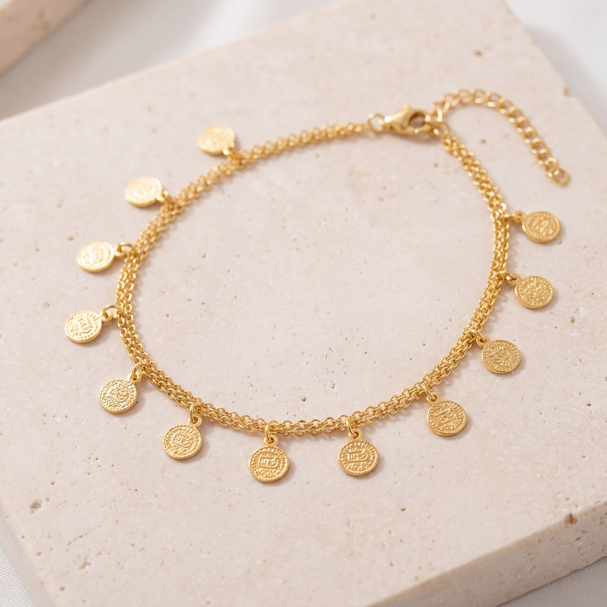 Coin Bracelet (D7) on travertine