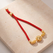 Crystal Globe Thread Bracelet on travertine