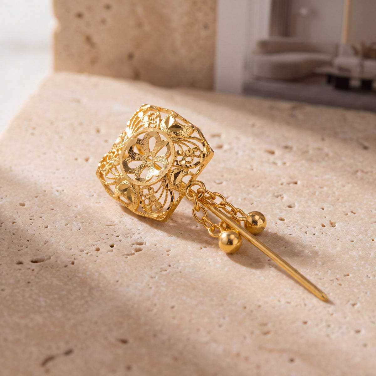 Daboos (D10) scarf pin on travertine stone