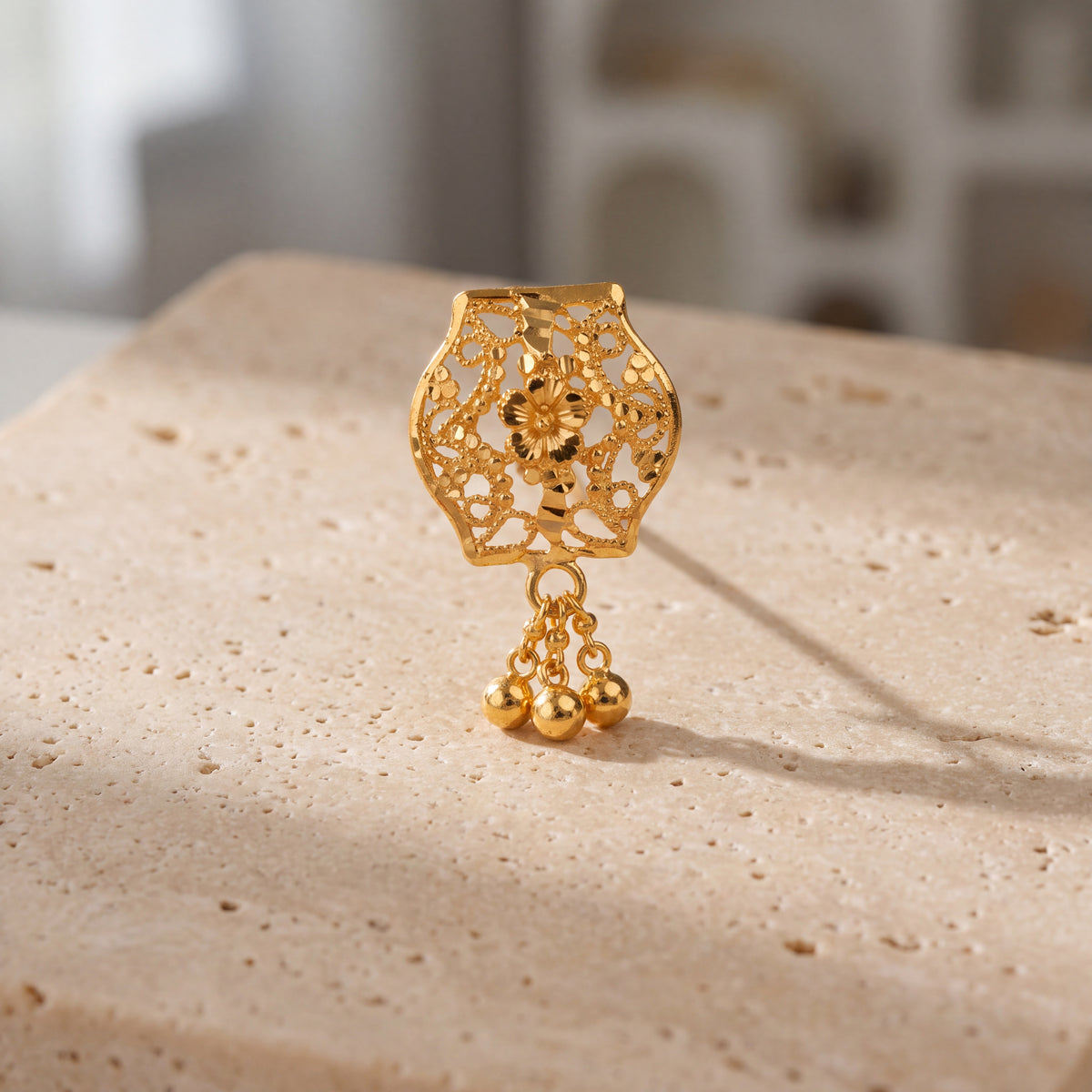 Daboos (D23) scarf pin on travertine stone
