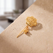 Daboos (D39) scarf pin on travertine stone
