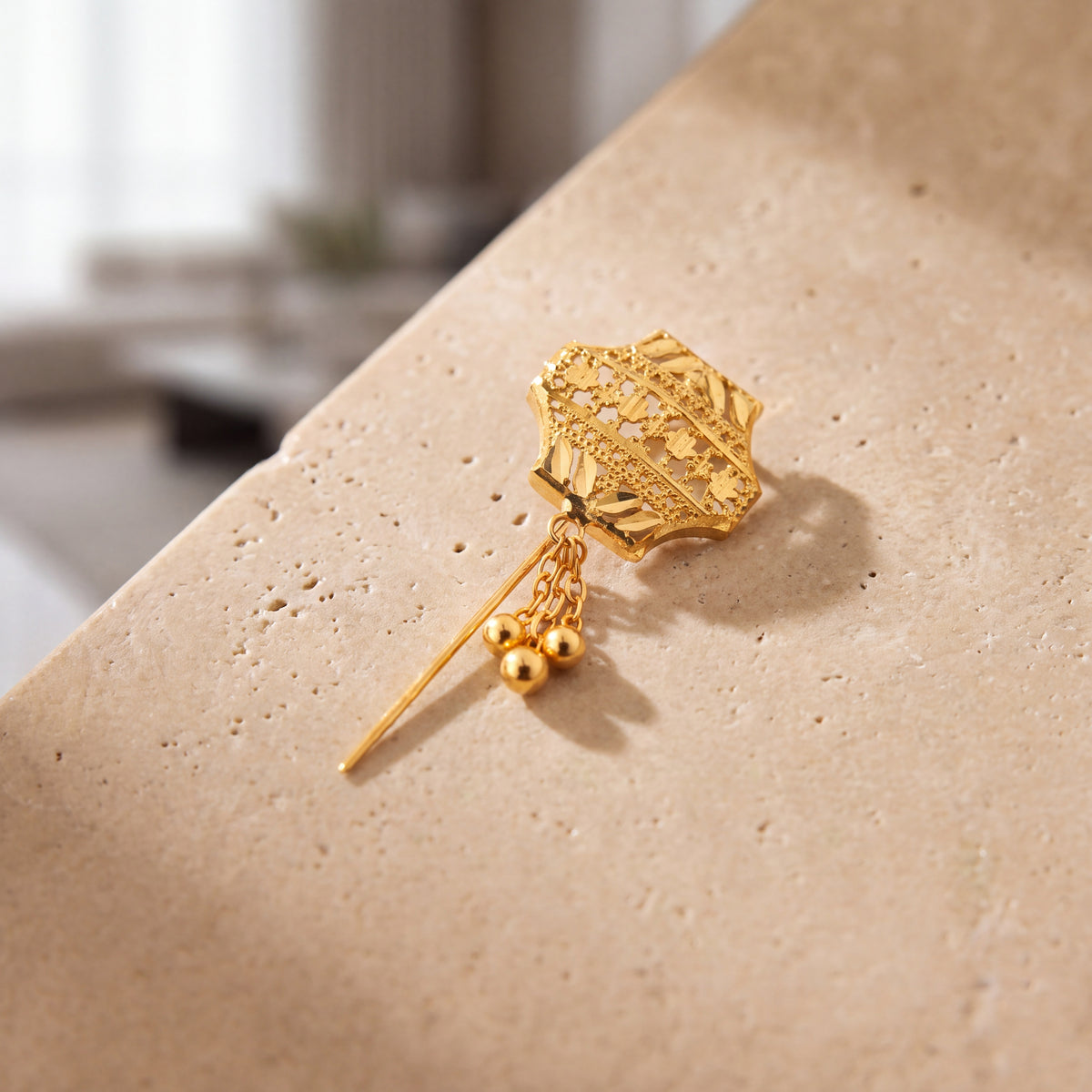 Daboos (D39) scarf pin on travertine stone
