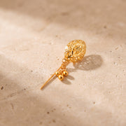 Daboos (D41) scarf pin on travertine stone