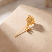 Daboos (D46) scarf pin on travertine stone