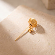 Daboos (D49) scarf pin on travertine stone