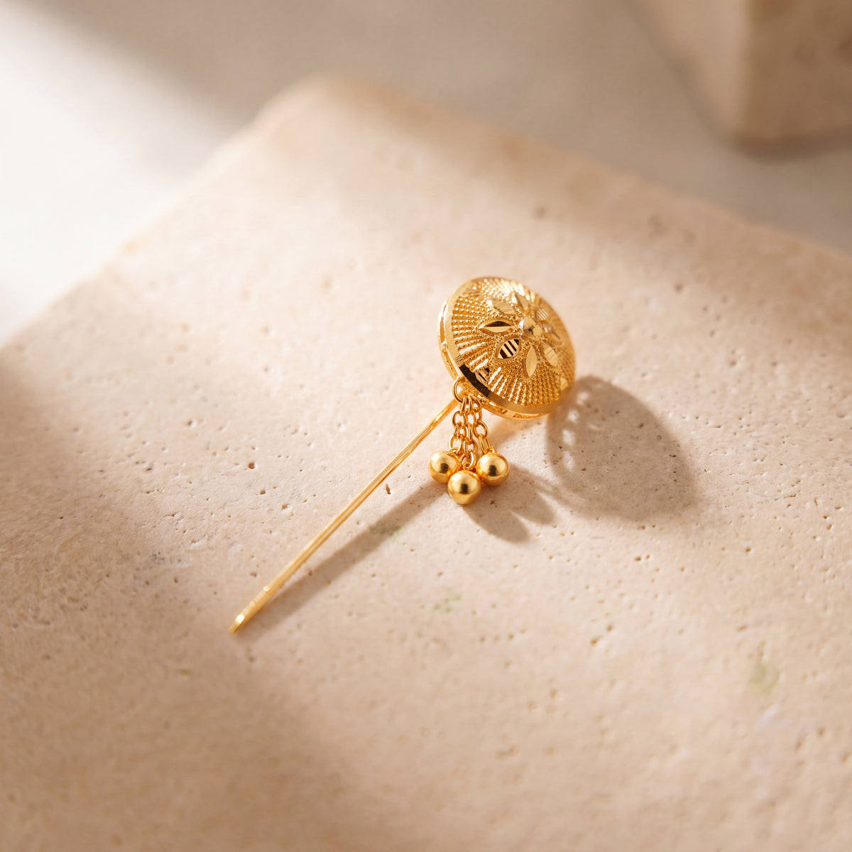 Daboos (D49) scarf pin on travertine stone