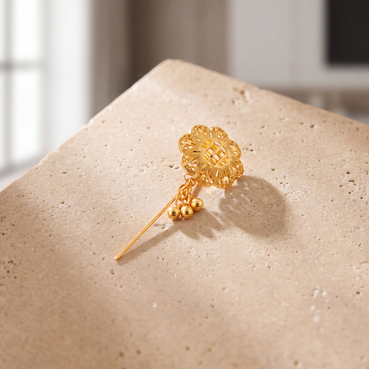 Daboos (D52) scarf pin on travertine stone