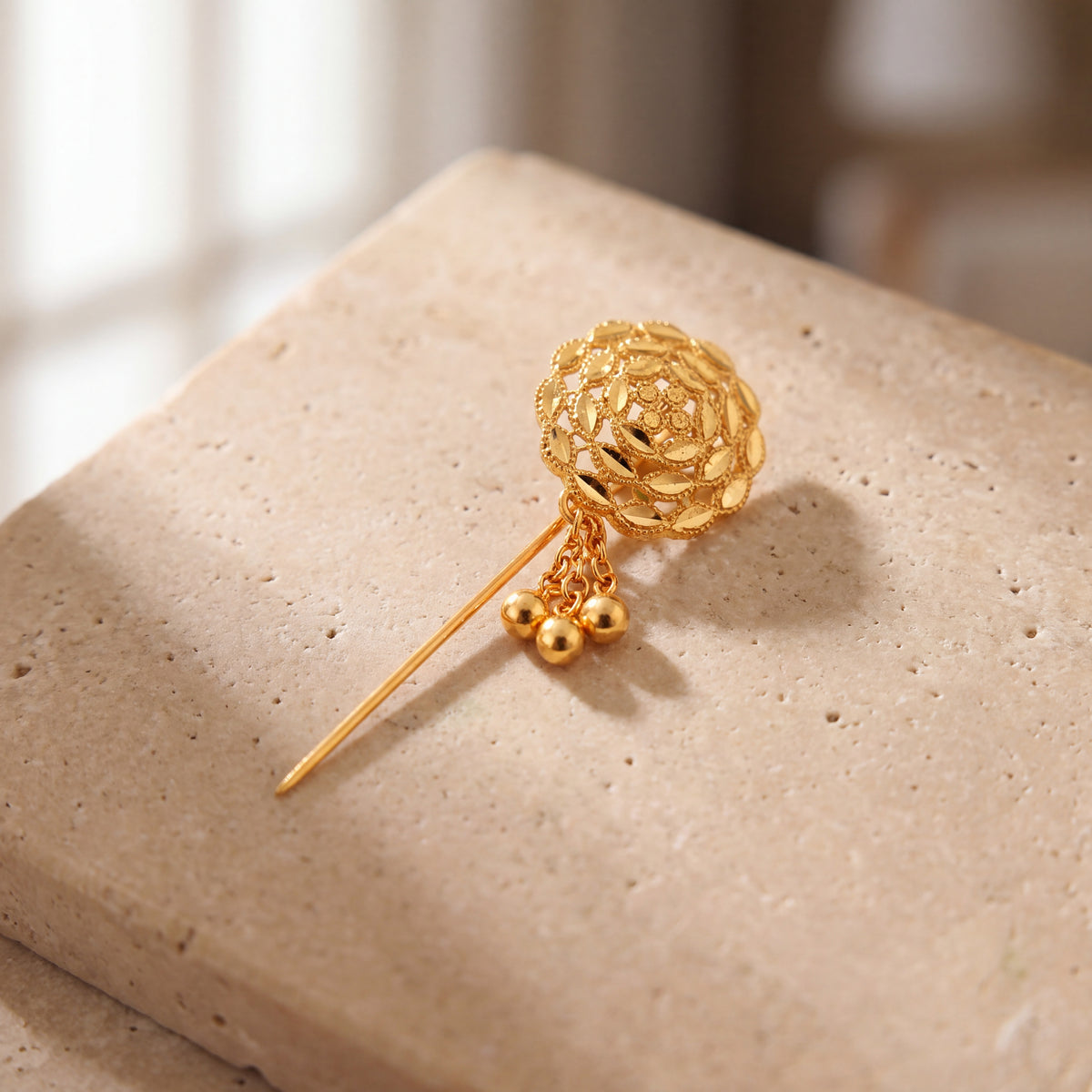 Daboos (D53) scarf pin on travertine stone