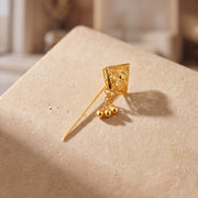 Daboos (D61) scarf pin on travertine stone