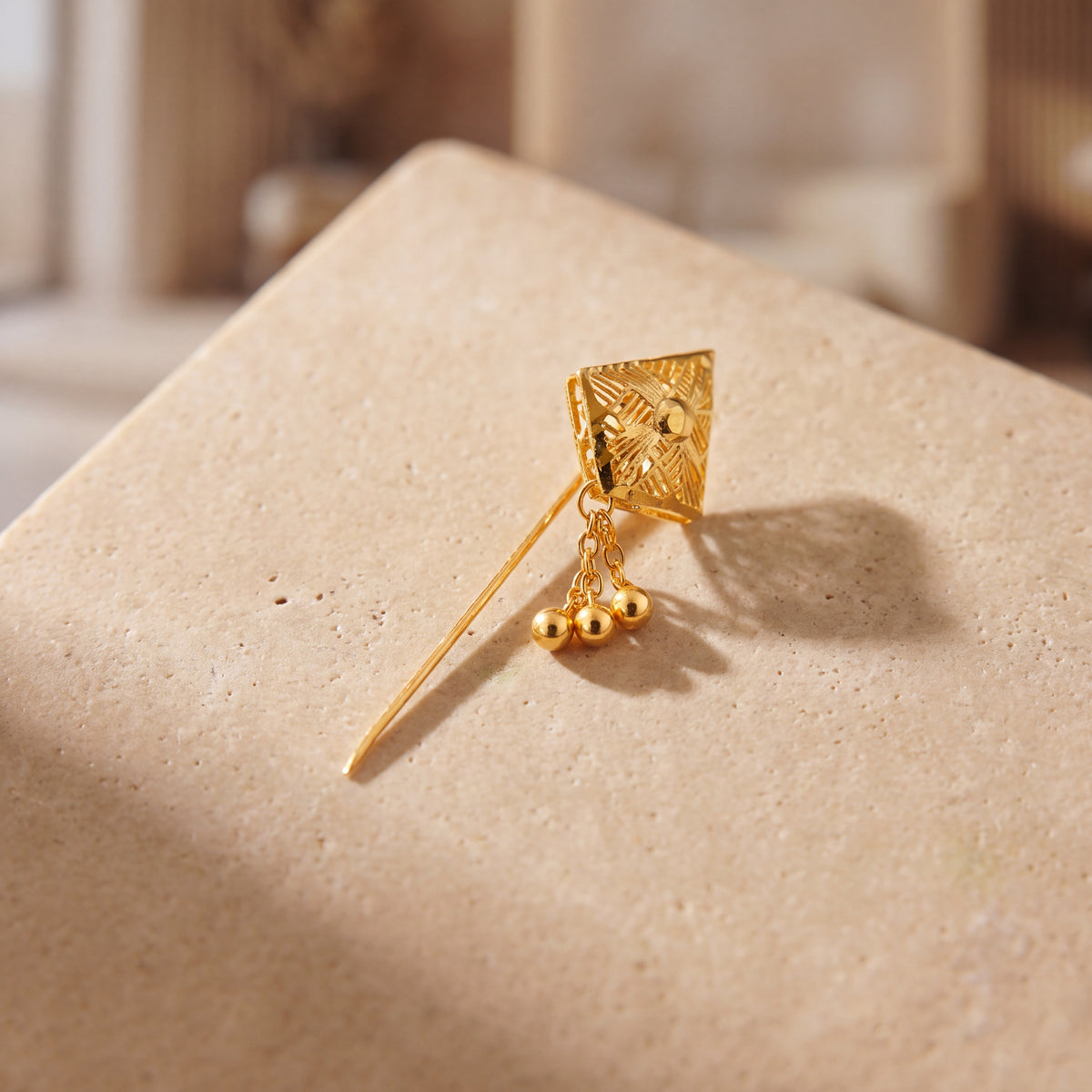 Daboos (D61) scarf pin on travertine stone